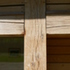 Copper roof sheet and flashings protect vulnerable oak members and joints, and junctions between glass and timber.