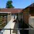 South Gate Yard is a two storey extension to a workshop building, on a large private estate. It houses secure stores for sensitive material, wc / tea point facilities, and meeting / office rooms reached across a timber bridge.