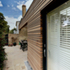 Fuchsia Cottage - external view due north - ground floor terrace + sunroom