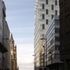 View down Chapel Street looking towards the River Mersey and showing the commercial portion of the scheme. In contrast to the tunnel-form residential tower the office block is framed allowing for flexible internal space