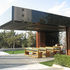 Cedar partitions may be folded away beneath the cantilevered roof