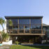Triple height north facing glazed screen overlooking mature gardens