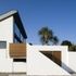 The two-storey building features a south-facing mono-pitch roof designed to take solar panels and a triple-height north-facing screen