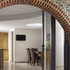 Guildford Lodge_Bi fold doors behind arch