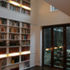 The double height bookshelf provides extensive book storage