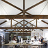 First floor open plan space with retained listed roof trusses
