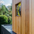 The cedar cladding and garage window