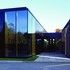 The reflective cladding reinterprets the building