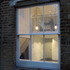 The storage loft was cut back and lowered to create a mezzanine level above the kitchen space