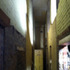 Walls and ceiling at ground floor were gradually removed to reveal the slot cut through the building. The ends were then glazed to light the void.