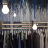 Lights hang down from the ceiling to illuminate the products on display