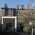 The brick used for the extension gives the impression of singular sculpted masonry mass 