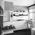 The kitchen viewed from the hall showing the hand-operated service lift