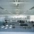 Meeting spaces and breakout area on a mezzanine overlooking the main gallery
