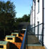 Rear of terrace showing balconies and storage sheds