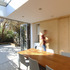 Concealed washing and drying area behind sliding doors in kitchen