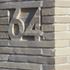 Street number carved into the brickwork