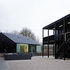 The two buildings face a shared courtyard, used by the centre for large installations