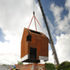 The welded building was craned into position