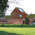 The building sits in the abstract landscape of the reedbeds at the boundary between the land and the sea
