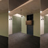 Studio meeting area with custom pullout TV bracket allowing doors to close behind TV
