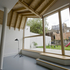 The butterfly roof construction is expressed internally