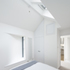 The bright and airy new first floor bedroom with its vaulted roof looking back towards the bathroom