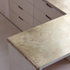 Brass worktop and handrail over the Birch plywood cabinets