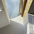 Junction of new sloped roof, projecting glazed roof, glazed ’slot’ and original façade 