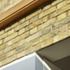 Detail of glazed ‘slot’ with continuation of brick façade internally
