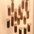 Bespoke hand-turned finger pulls with graphic pyramidal laser etch to top.