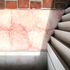 Visually elevated concrete threshold and depth register of new works.