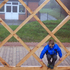 Child jumping through the timber lattice structure