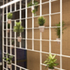 View of metal grid with ceramic pots.