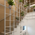 View of metal grid and wooden stair