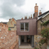 Bruton Narrow House - North elevation showing reconstructed rear portion of house and brick terraces