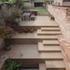 Bruton Narrow House - new brick terraces, steps & garden beyond 