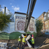 The central cruciform beam for the staircase being craned in through the new doorway