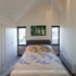 Bedroom with cladding over windows