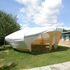 A wide entrance and an acrylic rooflight fill the interior space with natural light