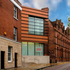 The new addition sits between two buildings of markedly different character