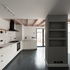 View into kitchen, dining, and living room