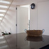 Metal stairs to roof with mesh creating shadows on the wall