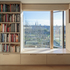 Dormer interior and loft library wall - window seat with view of allotments and skyline