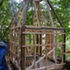 Studwork and french cleat hanging system to take the prefabricated thatch panels