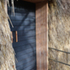 Sliding entrance door, using charred larch and douglas fir