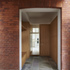 Fitted joinery units conceal entrance to the kitchen