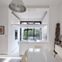 Kitchen with floating deck and garden beyond