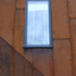 Corten cladding, sloping aluminium window