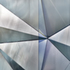 Close-up view of the folded semi-reflective surface and the vertical coated glass fin from the seventh floor